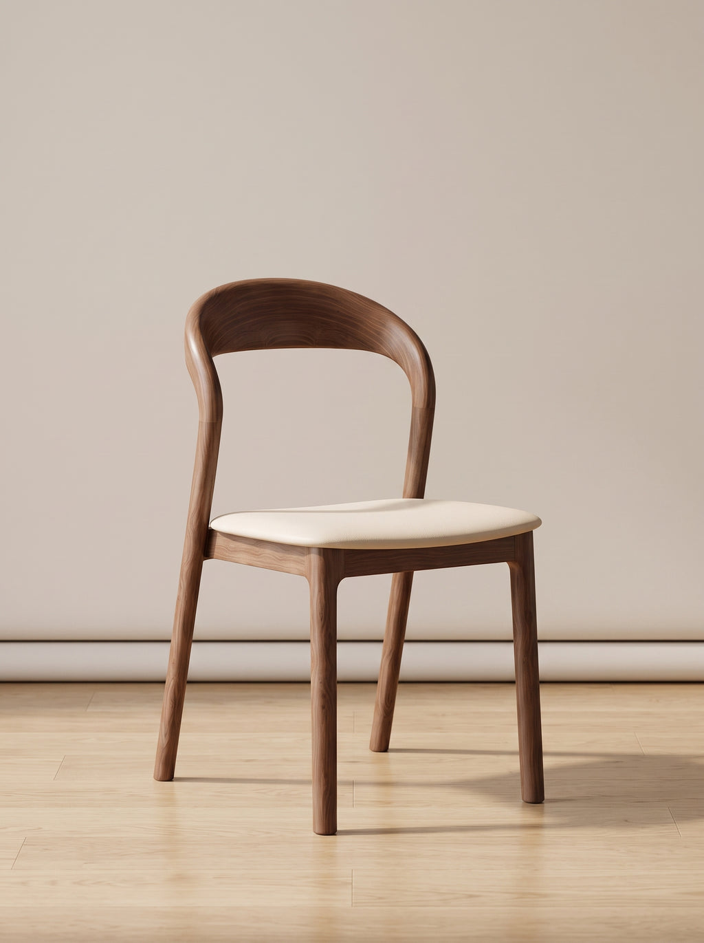 A mid-century modern wooden dining chair with a curved backrest and a cream upholstered seat, set against a minimalist beige wall and light wood floor.